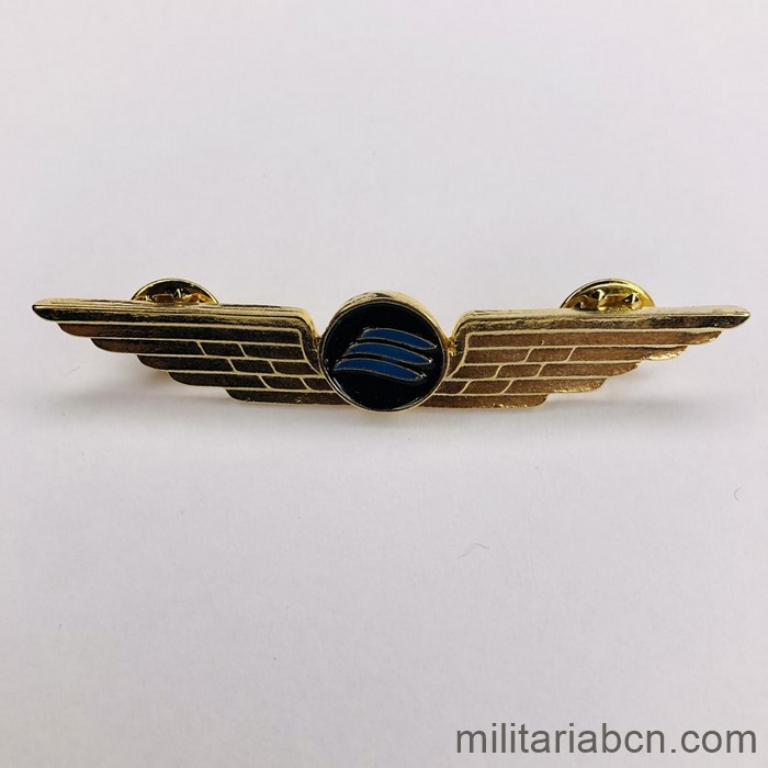 Libia. Alas de piloto de la compañía de aviación Afriqiyah Airways. Doradas.